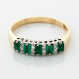 AN EMERALD AND DIAMOND RING