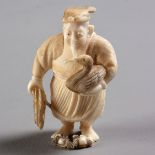 A JAPANESE IVORY NETSUKE OF A CORMORANT FISHERMAN, SHŌWA PERIOD, 1926 - 1989