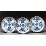 A SET OF THREE CHINESE BLUE AND WHITE 'PRUNUS AND PEONY' DISHES, QING DYNASTY, QIANLONG, 1735 - 1799