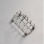 A GEORGE V SILVER TOAST RACK, HARRISON BROTHERS AND HOWSON, SHEFFIELD, 1912