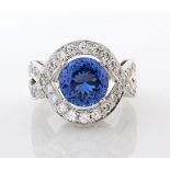 A TANZANITE AND DIAMOND RING