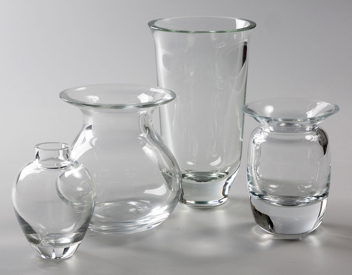 A COLLECTION OF FOUR CLEAR-GLASS VASES