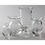 A COLLECTION OF FOUR CLEAR-GLASS VASES