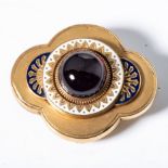 A VICTORIAN GARNET AND ENAMEL BROOCH