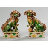 A PAIR OF CHINESE SANCAI-GLAZE 'FU DOG' INCENSE HOLDERS