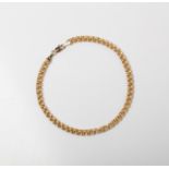 A 9CT GOLD FANCY LINK BRACELET