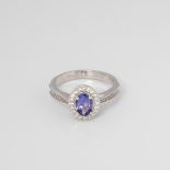 9CT WHITE GOLD TANZANITE AND DIAMOND OVAL HALO RING