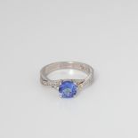 9CT WHITE GOLD TANZANITE AND DIAMOND CROSSOVER RING