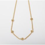 A 9CT GOLD ROSE NECKLACE