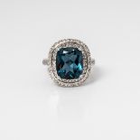 9CT WHITE GOLD CUSHION LONDON BLUE TOPAZ AND DIAMOND DOUBLE HALO RING