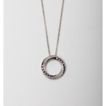 A SILVER PINK SAPPHIRE AND DIAMOND CIRCLE OF LIFE PENDANT ON A 45CM CHAIN