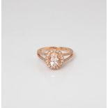 9CT ROSE GOLD OVAL MORGANITE, WHITE SAPPHIRE AND DIAMOND HALO RING