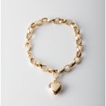 A 9CT GOLD & SILVER BONDED PUFF HEART BRACELET