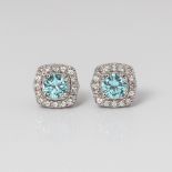 9CT WHITE GOLD BLUE TOPAZ, CREATED SAPPHIRE AND DIAMOND HALO STUD EARRINGS