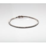 18CT WHITE GOLD BLACK DIAMOND TENNIS BRACELET