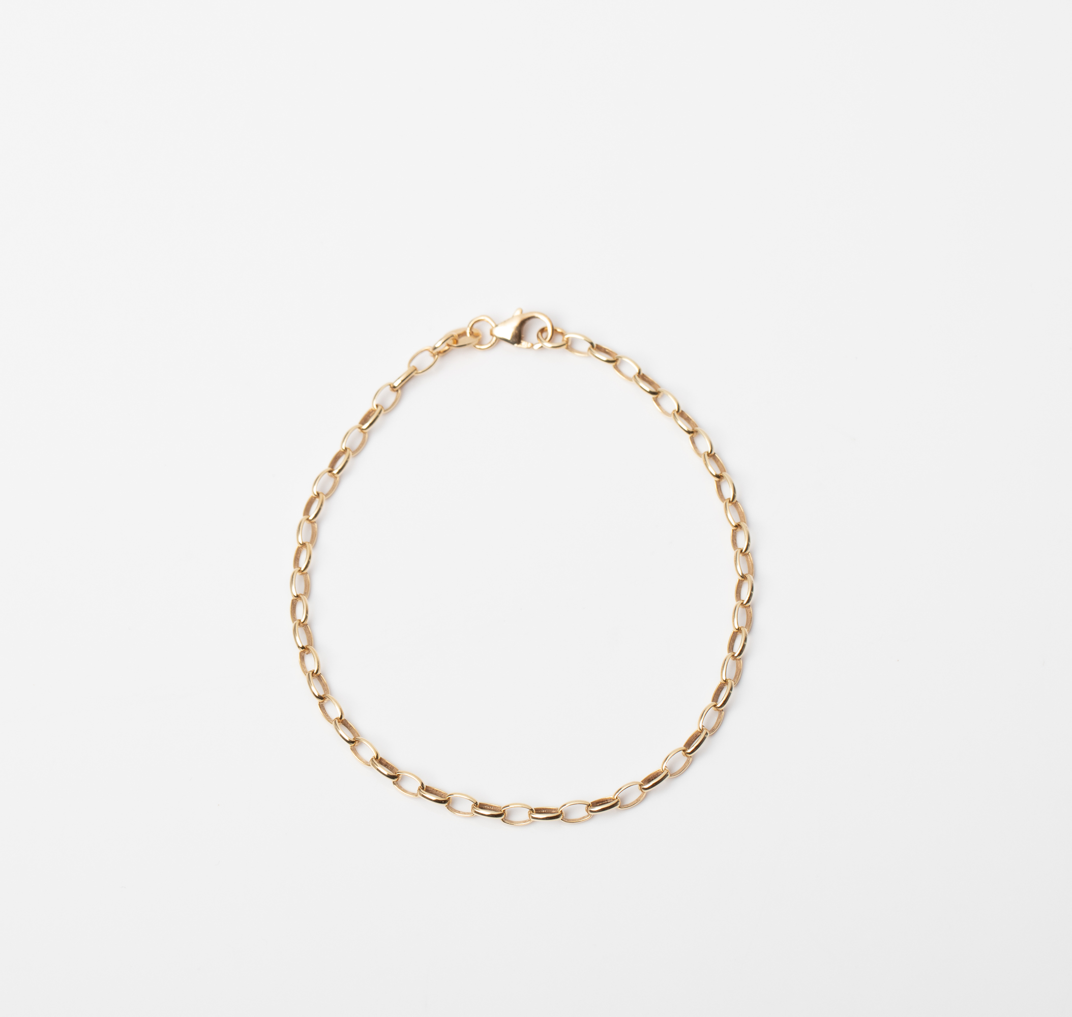 A 9CT GOLD & SILVER BONDED ROLO BRACELET