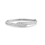 AN 18CT WHITE GOLD WIND MASTERPIECE CROSSOVER BANGLE
