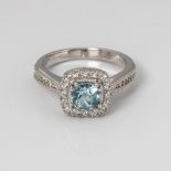 9CT WHITE GOLD BLUE TOPAZ, CREATED SAPPHIRE AND DIAMOND HALO RING