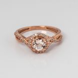 9CT ROSE GOLD MORGANITE AND DIAMOND HALO TWIST RING