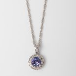 9CT WHITE GOLD TANZANTE AND DIAMOND HALO PENDANT ON A CHAIN