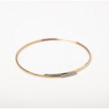 A TWO TONE 9CT GOLD CZ BANGLE