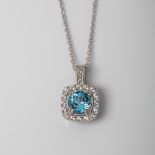 9CT WHITE GOLD BLUE TOPAZ, CREATED SAPPHIRE AND DIAMOND HALO PENDANT ON CHAIN