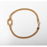 A 9CT GOLD KNOT BRACELET