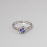 9CT WHITE GOLD TANZANITE AND DIAMOND HALO RING