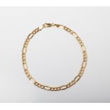 A 9CT GOLD FIGARO BRACELET