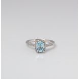 9CT WHITE GOLD BLUE TOPAZ AND DIAMOND HALO RING