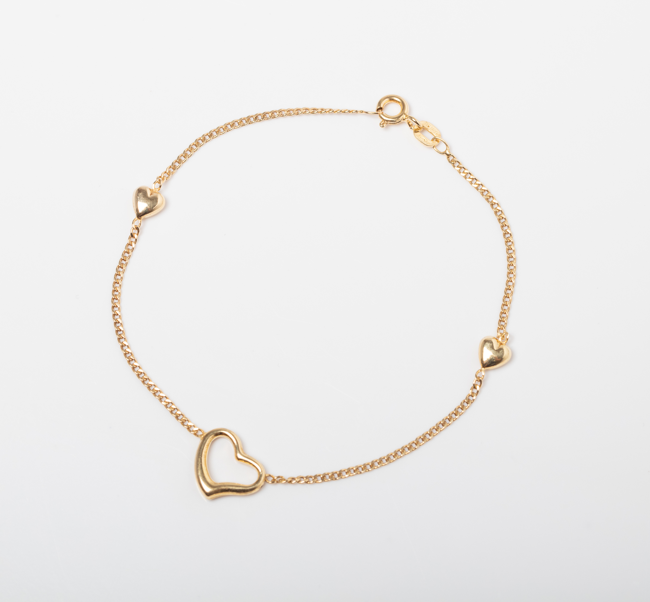 A 9CT GOLD & SILVER BONDED HEART BRACELET