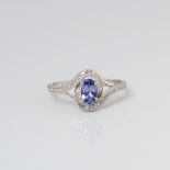 9CT GOLD TANZANITE AND DIAMOND SWIRL DRESS RING