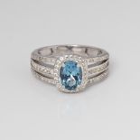 9CT WHITE GOLD BLUE TOPAZ AND DIAMOND OVAL HALO RING