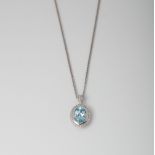 9CT WHITE GOLD BLUE TOPAZ AND DIAMOND OVAL HALO PENDANT ON CHAIN