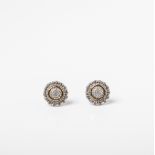 A PAIR OF 9CT GOLD AND SILVER MULTISTONE DIAMOND HALO STUD EARRINGS