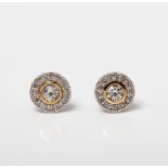 A PAIR OF SILVER WHITE SAPPHIRE HALO STUD EARRINGS