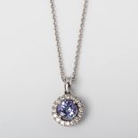 9CT WHITE GOLD TANZANITE AND DIAMOND HALO PENDANT