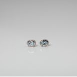 9CT WHITE GOLD BLUE TOPAZ AND DIAMOND OVAL HALO EARRINGS