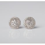 A PAIR OF SILVER DIAMOND AND CREATED WHITE SAPPHIRE HALO EARRINGS