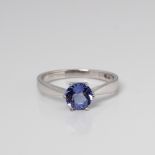 9CT WHITE GOLD TANZANITE SOLITARIE RING WITH SIDE DIAMOND ACCENTS