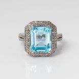 9CT WHITE GOLD EMERALD CUT BLUE TOPAZ AND DIAMOND DRESS RING