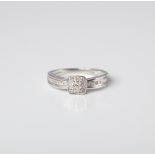 A 9CT WHITE GOLD MULTISTONE DIAMOND CUSHION SHAPED HALO RING