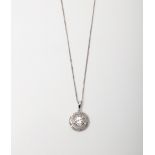 A SILVER SWIRL DIAMOND PENDANT ON A 45CM CHAIN