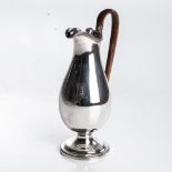 A GEORGE III SILVER COVERED JUG