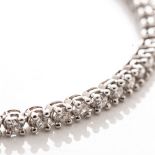 A DIAMOND TENNIS BRACELET