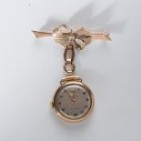 A LADY'S GOLD CYMA NURSES WATCH