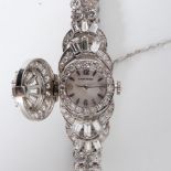 A LADY'S CARTIER DIAMOND WRISTWATCH