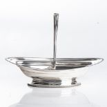 A GEORGE III SILVER CAKE BASKET