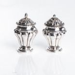 A PAIR OF INDIAN COLONIAL SILVER SALT AND PEPPER SHAKERS