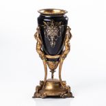 A CONTINENTAL PORCELAIN AND GILT-METAL PEDESTAL URN